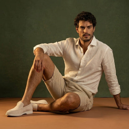 Anzio Loafer Ivory, worn with linen, seated